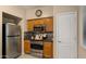 A kitchen featuring stainless steel appliances and wooden cabinets at 3872 E Flower St, Gilbert, AZ 85298