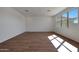 Bedroom with wood-look floors, natural light, and neutral walls, creating a cozy atmosphere at 4069 W Nora Dr, San Tan Valley, AZ 85144