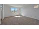 Bedroom features neutral carpet, an abundance of natural light and neutral paint at 4069 W Nora Dr, San Tan Valley, AZ 85144