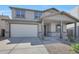 Charming two-story home featuring a covered porch, stone accents and a two car garage at 4069 W Nora Dr, San Tan Valley, AZ 85144