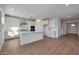 Bright kitchen featuring white cabinets, stainless steel appliances, and an island perfect for cooking at 4069 W Nora Dr, San Tan Valley, AZ 85144