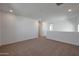 Upstairs loft with neutral carpet and walls creating a versatile space for work or leisure at 4069 W Nora Dr, San Tan Valley, AZ 85144