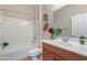 Bathroom featuring a shower and tub combo, a vanity, and a toilet at 42906 W Darter Dr, Maricopa, AZ 85138