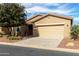 Charming single-story home with neutral stucco, tile roof, and a well-maintained front yard at 42906 W Darter Dr, Maricopa, AZ 85138