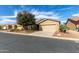 Charming single-story home with neutral stucco, tile roof, and a well-maintained front yard at 42906 W Darter Dr, Maricopa, AZ 85138