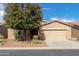 Charming single-story home with neutral stucco, tile roof, and a well-maintained front yard at 42906 W Darter Dr, Maricopa, AZ 85138