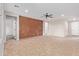 Bright living room with tile floors and accent wall at 42906 W Darter Dr, Maricopa, AZ 85138