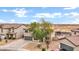 Overhead view of a beautiful home with a spacious driveway and well-maintained desert landscaping at 4473 E Whitehall Dr, San Tan Valley, AZ 85140