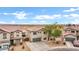 Aerial view of a home with beautiful landscaping, a two-car garage, and Spanish tile roof at 4473 E Whitehall Dr, San Tan Valley, AZ 85140