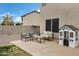 Relaxing backyard seating area with a small playhouse, perfect for enjoying the outdoors in comfort at 4473 E Whitehall Dr, San Tan Valley, AZ 85140