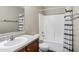 Well-lit bathroom with a single sink vanity, toilet, and shower-tub combination at 4473 E Whitehall Dr, San Tan Valley, AZ 85140