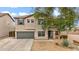 Charming two-story home featuring a well-manicured front yard and attached two car garage at 4473 E Whitehall Dr, San Tan Valley, AZ 85140