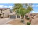 Attractive two-story home with desert landscaping, attached garage and a well-manicured front yard at 4473 E Whitehall Dr, San Tan Valley, AZ 85140