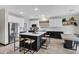 Modern kitchen with two-tone cabinetry, stainless steel appliances, and central island at 4473 E Whitehall Dr, San Tan Valley, AZ 85140