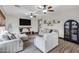 Spacious living room featuring comfortable seating, a large TV, and modern accents at 4473 E Whitehall Dr, San Tan Valley, AZ 85140