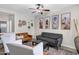 Cozy living room featuring neutral paint, modern furnishings, and plenty of light at 4473 E Whitehall Dr, San Tan Valley, AZ 85140