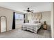 Bright main bedroom with ceiling fan and black out curtains at 4473 E Whitehall Dr, San Tan Valley, AZ 85140