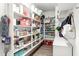 Well-organized walk-in pantry with ample shelving for storage and household goods at 4473 E Whitehall Dr, San Tan Valley, AZ 85140