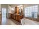 Elegant bathroom features dual sinks, soaking tub, and stylish tile work, creating a spa-like atmosphere at 4552 E Chuckwalla Cyn, Phoenix, AZ 85044