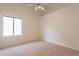 Bright bedroom featuring vaulted ceilings, neutral carpeting, and an abundance of natural light at 4552 E Chuckwalla Cyn, Phoenix, AZ 85044