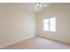 Bright bedroom features neutral walls, carpet flooring, a ceiling fan, and a window at 4552 E Chuckwalla Cyn, Phoenix, AZ 85044