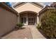 Charming front entrance with a decorative security gate, pathway, and desert landscaping for curb appeal at 4552 E Chuckwalla Cyn, Phoenix, AZ 85044