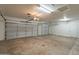 Well-lit garage with multiple garage doors, offering convenience and ample space for parking and storage at 4552 E Chuckwalla Cyn, Phoenix, AZ 85044