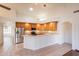 Bright kitchen features stainless steel appliances and a breakfast bar at 4552 E Chuckwalla Cyn, Phoenix, AZ 85044