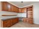 Office featuring custom cabinetry, granite countertops, and built-in shelving for storage and organization at 4552 E Chuckwalla Cyn, Phoenix, AZ 85044