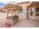 Outdoor kitchen with a covered grill area, providing a functional and stylish space for al fresco dining at 4552 E Chuckwalla Cyn, Phoenix, AZ 85044