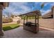 Charming outdoor kitchen with a built-in grill and countertop space, ideal for backyard barbecues and gatherings at 4552 E Chuckwalla Cyn, Phoenix, AZ 85044