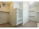 Organized walk-in closet with multiple shelves, and a full-length door mirror at 4552 E Chuckwalla Cyn, Phoenix, AZ 85044