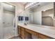 Bathroom featuring a large mirror, vanity, and a shower with tub combo at 4725 E Brown Rd # 59, Mesa, AZ 85205