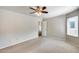 Spacious bedroom with a ceiling fan and natural light from the window at 4725 E Brown Rd # 59, Mesa, AZ 85205