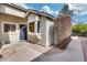 Cozy front entrance with a decorative security door and a small window, complemented by desert landscaping at 4725 E Brown Rd # 59, Mesa, AZ 85205