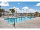 Community pool featuring clear blue water, a safety fence, and a relaxing environment for residents at 4725 E Brown Rd # 59, Mesa, AZ 85205