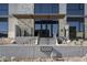 Building entrance with stone accents and desert landscaping at 5000 N Camelback Ridge Rd # 210, Scottsdale, AZ 85251