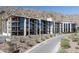 Modern condo building with balconies and desert landscaping nestled at the base of a mountain at 5000 N Camelback Ridge Rd # 210, Scottsdale, AZ 85251