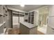 Spacious walk-in closet featuring custom shelving, drawers, and a central island for optimal organization and convenience at 5000 N Camelback Ridge Rd # 210, Scottsdale, AZ 85251