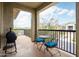 Balcony with grill and seating overlooks neighborhood streets and desert landscaping at 5100 E Rancho Paloma Dr # 2024, Cave Creek, AZ 85331