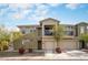 Charming two-story home with a balcony, two car garage, and desert landscaping at 5100 E Rancho Paloma Dr # 2024, Cave Creek, AZ 85331