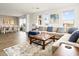 Open concept living room with lots of natural light and hardwood style floors leads to dining area at 5100 E Rancho Paloma Dr # 2024, Cave Creek, AZ 85331