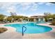 Community pool area featuring a swimming pool, lounge chairs, and covered seating at 5100 E Rancho Paloma Dr # 2024, Cave Creek, AZ 85331