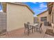 Private backyard patio with brick pavers and an outdoor dining set, perfect for entertaining and relaxation at 5206 W Desert Hills Dr, Glendale, AZ 85304