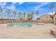 Beautiful community pool surrounded by palm trees and lounge area for relaxing at 5206 W Desert Hills Dr, Glendale, AZ 85304