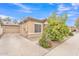 Exterior view showing desert landscaping, driveway, tile roof, and convenient two car garage at 5206 W Desert Hills Dr, Glendale, AZ 85304