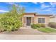 Charming single-story home featuring stone accents, low maintenance desert landscaping, and a mature lemon tree at 5206 W Desert Hills Dr, Glendale, AZ 85304