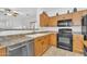 Kitchen featuring classic cabinetry, efficient appliances, and ample counter space for meal preparation at 5206 W Desert Hills Dr, Glendale, AZ 85304