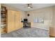 Versatile bedroom showcases a built-in Murphy bed, desk, and ample storage for a flexible space at 5210 E Danbury Rd, Scottsdale, AZ 85254