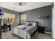 Neutral gray bedroom with a bed and two windows, providing natural light and a peaceful ambiance at 5210 E Danbury Rd, Scottsdale, AZ 85254